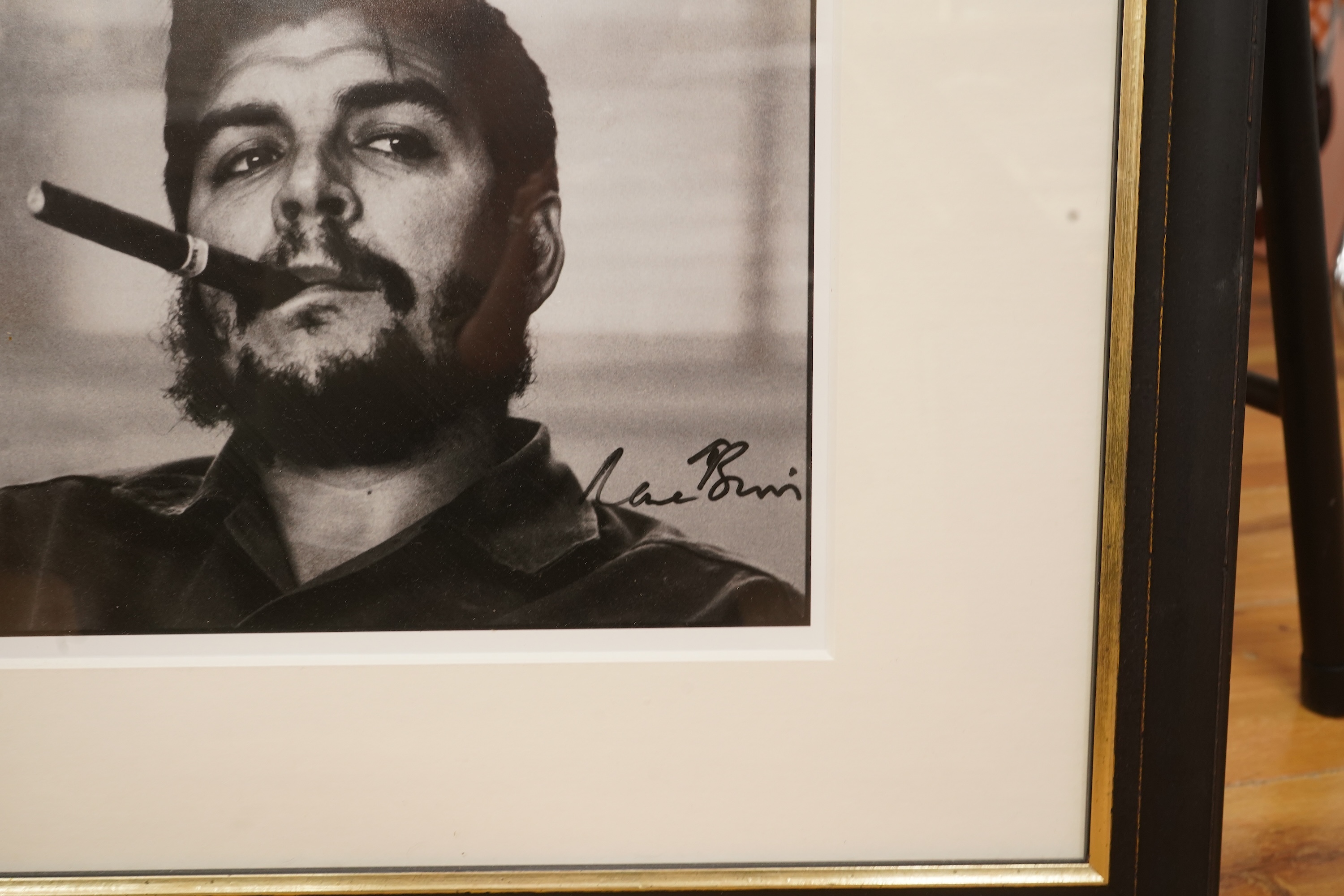 After Rene Burri (1933-2014), ‘Che Guevara smoking a cigar’, facsimile signature, gelatin silver print, 25 x 32cm